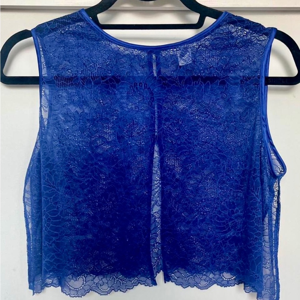 Blue lace top with open back button